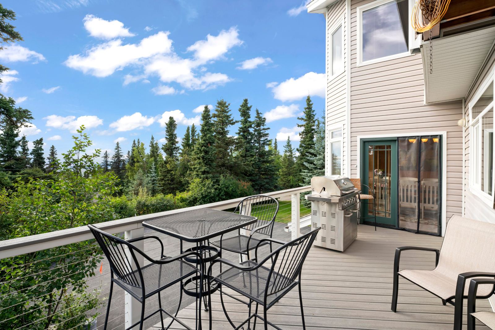 Main deck with stainless gas grill and bistro table