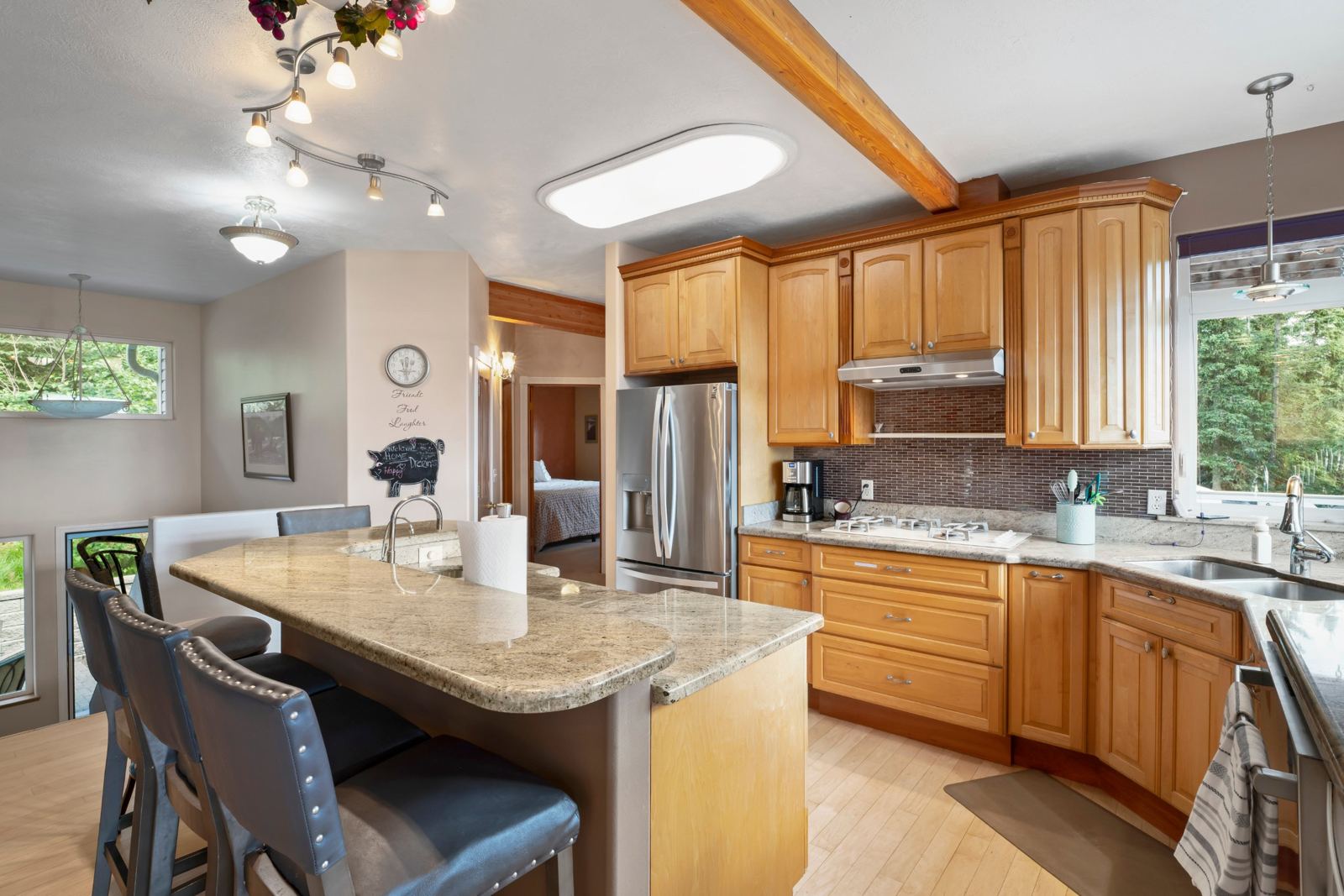 Gas cooktop and coffee maker beside the kitchen island