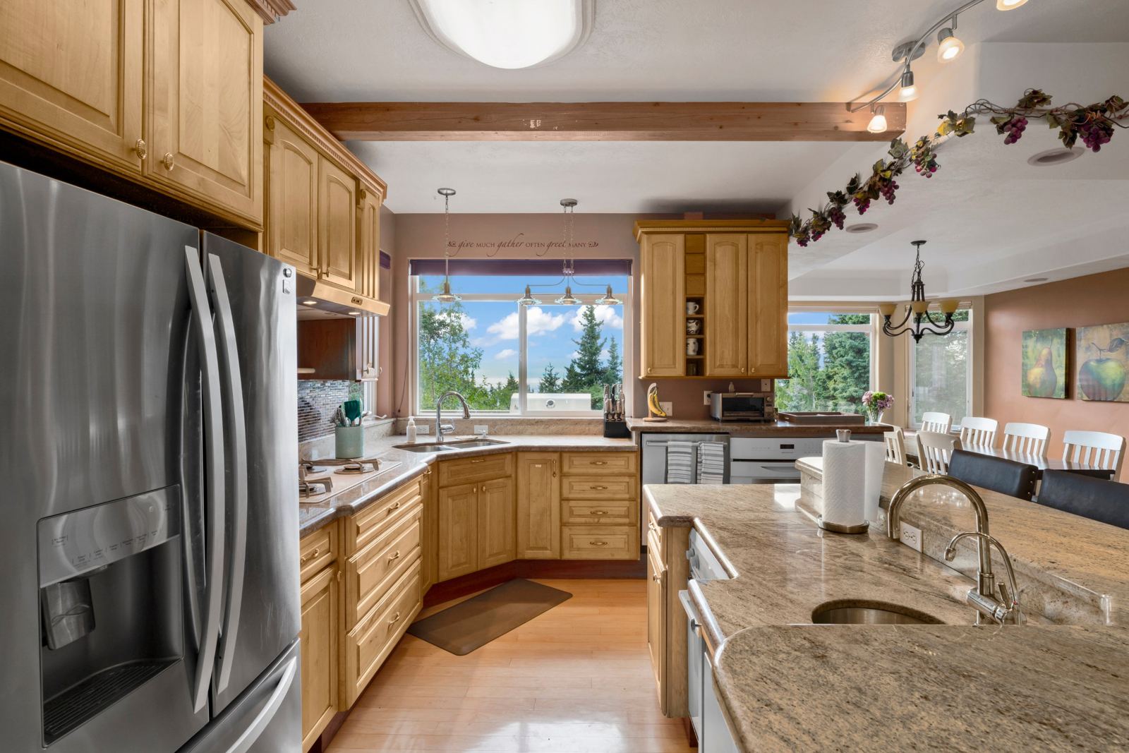 Kitchen looking through to the dining table and bay windows